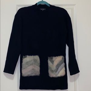 Black soft long sweater with faux fur pockets
